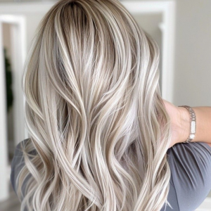 Platinum cashmere and honey glass blonde — glossy, creamy blonde tones for 2025